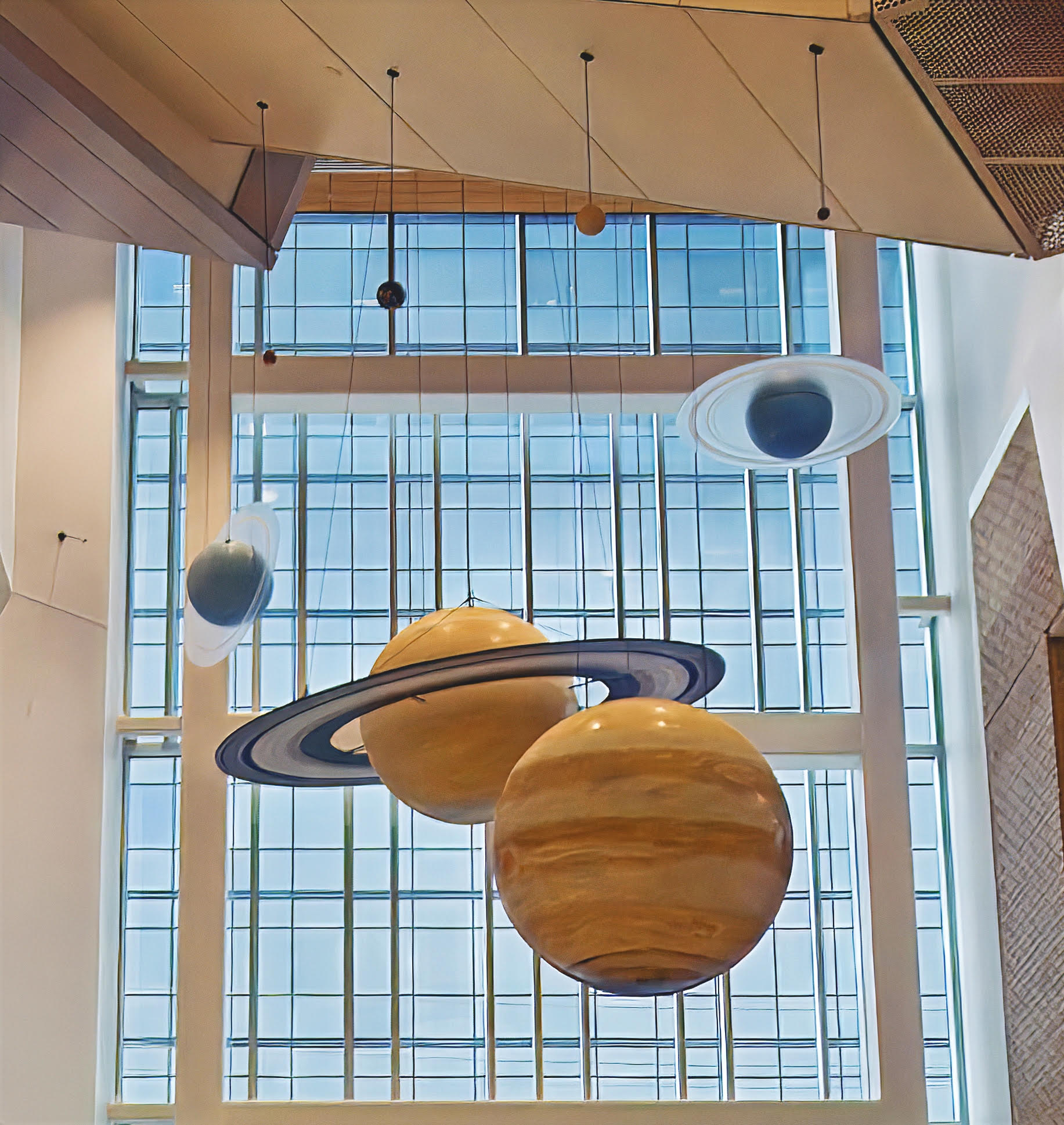 Solar system planet models suspended in the lobby atrium